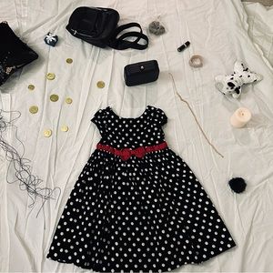 Fancy black and white polka dot dress with burgundy ribbon